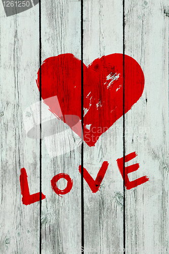 Image of heart on wooden wall