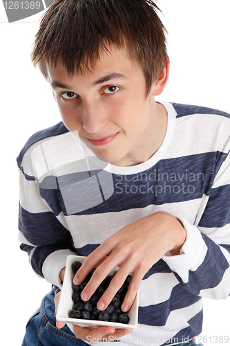 Image of Blueberries superfood - boy eating blueberries