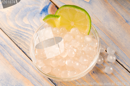 Image of tapioca pearls with lime. white bubble tea ingredients