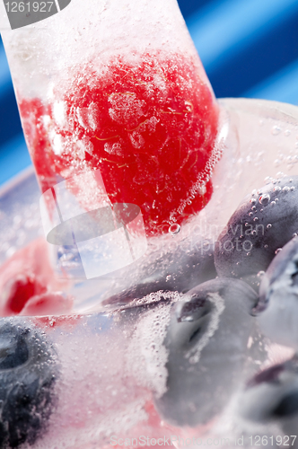 Image of Raspberry and blackberry frozen in ice sticks