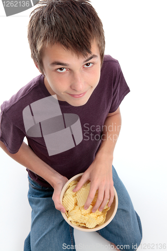 Image of Boy eating potato chips