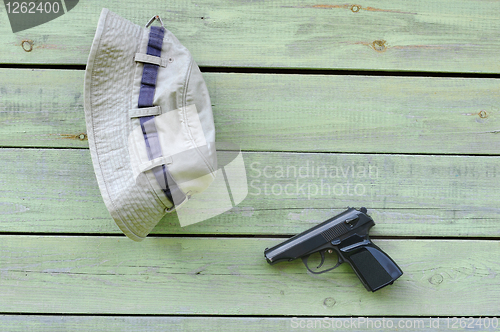 Image of Hat and Pistol on the Wall