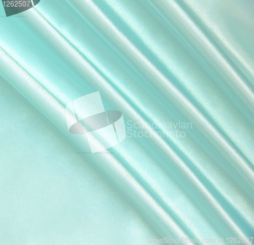 Image of Smooth elegant blue silk as background 