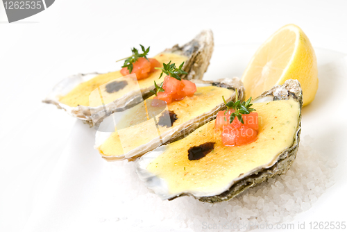 Image of oysters with sauce and lemon