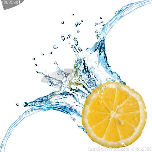 Image of Fresh lemon dropped into water with splash isolated on white