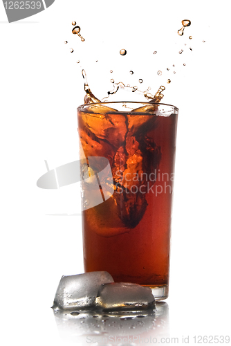 Image of Beautiful splash of cola in glass isolated on white