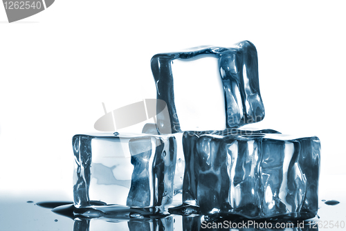 Image of ice cubes with water drops on white