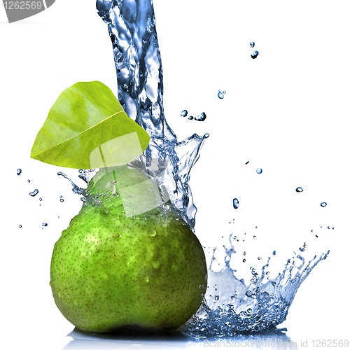 Image of green pear with leaf and water splash isolated on white
