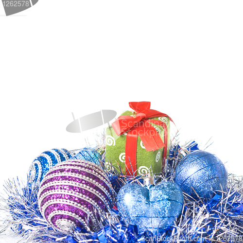Image of christmas balls with and gift with decoration isolated on white