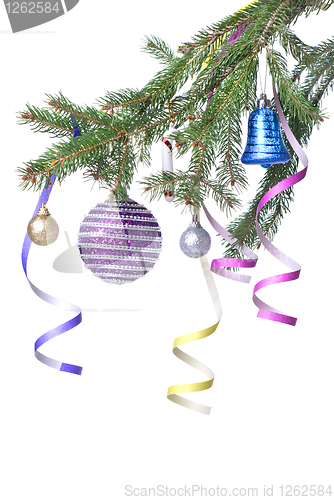 Image of Christmas balls and decoration on fir tree branch isolated on wh