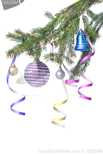 Image of Christmas balls and decoration on fir tree branch isolated on wh