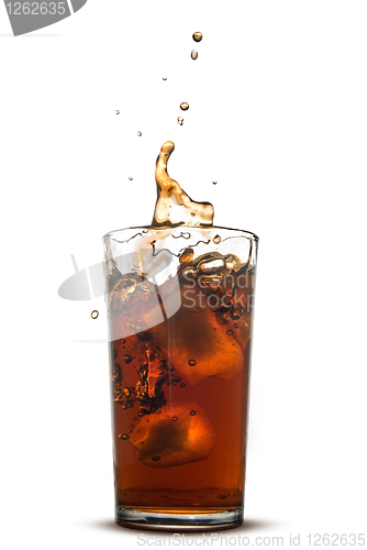 Image of Beautiful splash of cola in glass isolated on white