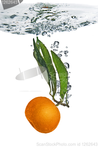 Image of Splash of orange to water with bubbles of air