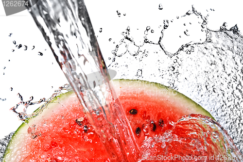 Image of watermelon and water splash isolated on white