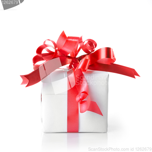 Image of Holiday gift with red ribbon isolated on white