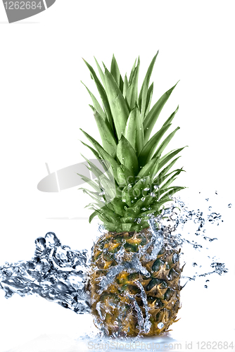 Image of pineapple with water splash isolated on white