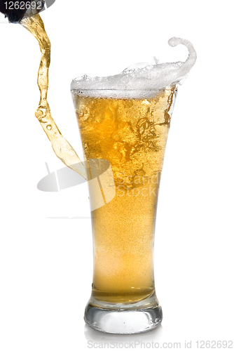 Image of Beer pouring from bottle into glass isolated on white