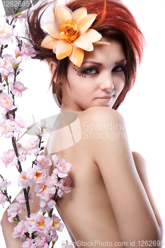 Image of Portrait of beautiful woman with cherry flowers  on white