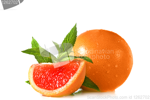 Image of Water splash on grapefruit with mint isolated on white