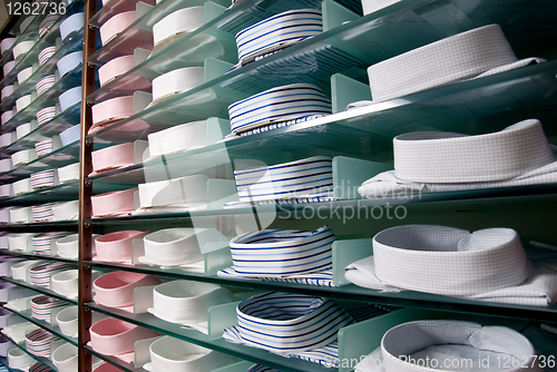 Image of shelf with shirts in store