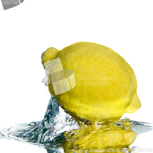 Image of Fresh lemon on water with bubbles isolated on white