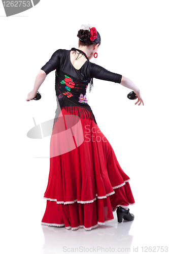 Image of young woman dancing flamenco with castanets isolated on white