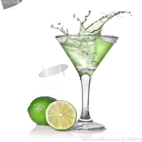 Image of Green alcohol cocktail with splash and green lime isolated on wh