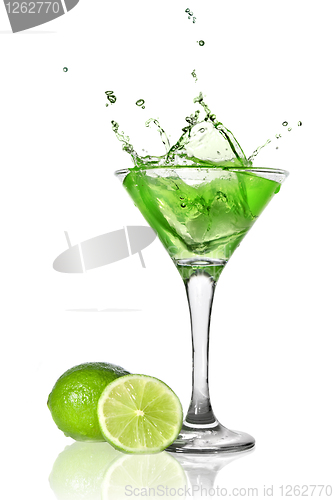 Image of Green alchohol cocktail with splash and green lime isolated on w