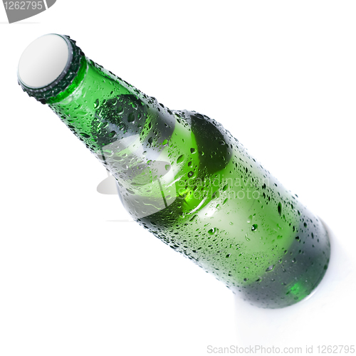 Image of Green beer bottle with water drops isolated on white