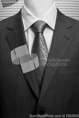 Image of business dark grey suite with white shirt and tie