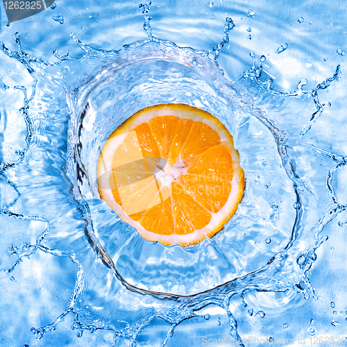 Image of Fresh orange dropped into water with bubbles isolated on white