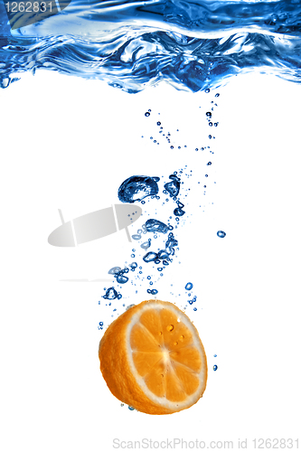 Image of Fresh orange dropped into water with bubbles isolated on white