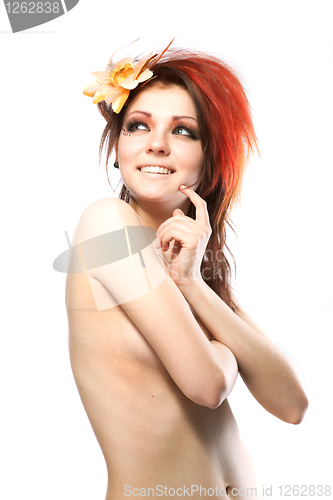 Image of Portrait of beautiful naked woman with spring flower in hair on 