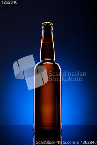 Image of Beer bottle on blue background