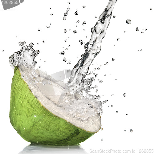 Image of Green coconut with water splash isolated on white