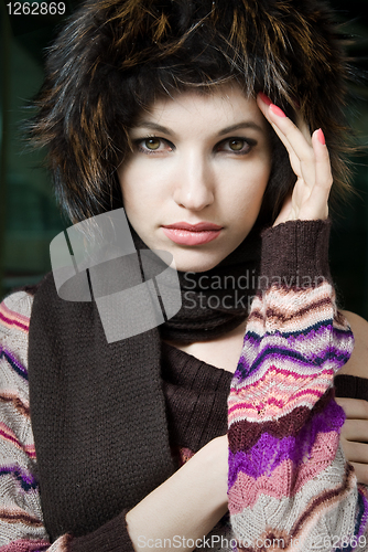Image of winter portrait of young woman in fur hat