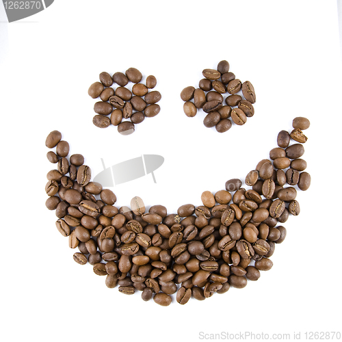 Image of smile from coffee beans isolated on white