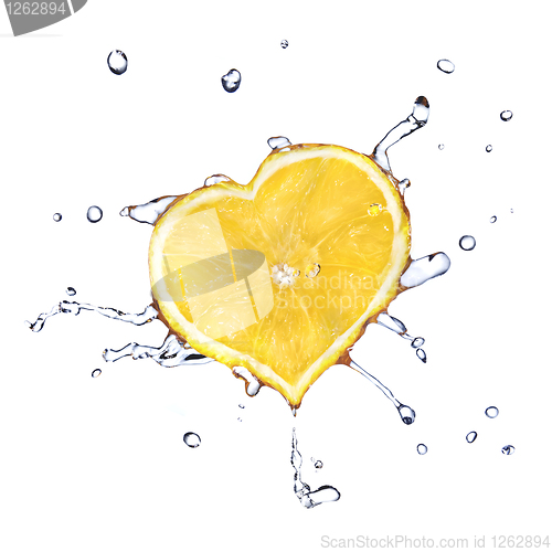 Image of heart from lemon dropped into water isolated on white