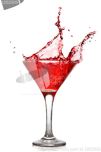 Image of Red cocktail with splash isolated on white