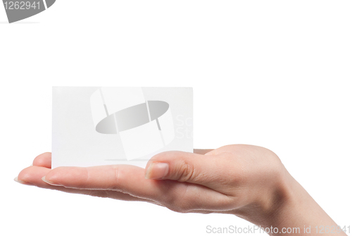 Image of Woman hand holding empty visiting card and pointing on it isolat