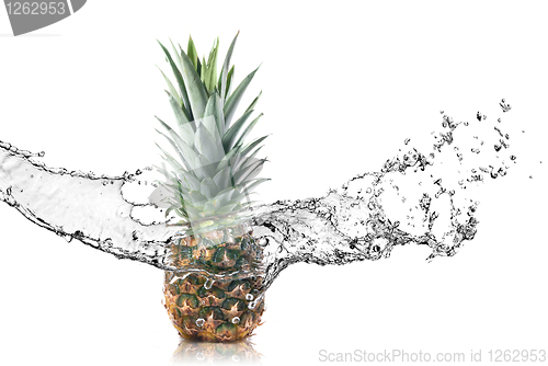 Image of pineapple with water splash isolated on white