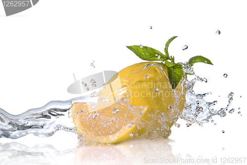 Image of Water splash on grapefruit with mint isolated on white