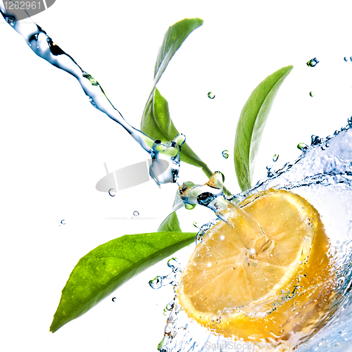 Image of water drops on lemon with green leaves isolated on white