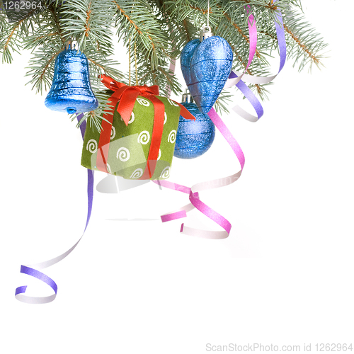 Image of Christmas balls, gift and decoration on fir tree branch isolated