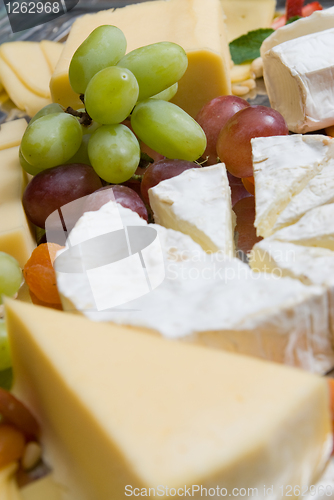 Image of appetizer from cheese and grape