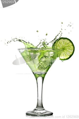Image of Green alcohol cocktail with splash and green lime isolated on wh