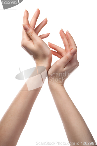 Image of figure from female hands isolated on white