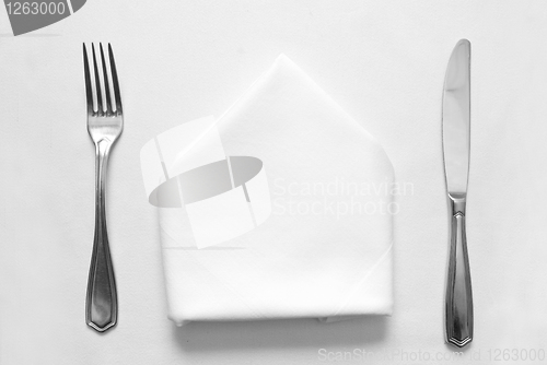 Image of knife, fork and napkin in restaurant