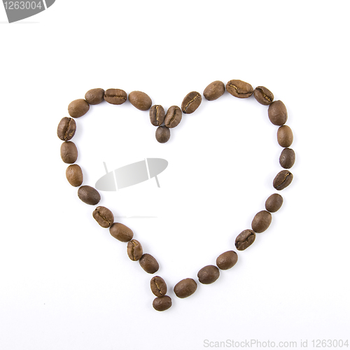 Image of heart from coffee beans isolated on white