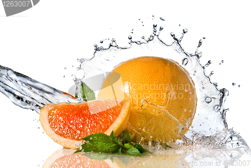 Image of Water splash on orange with mint isolated on white